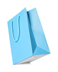 One light blue shopping bag isolated on white