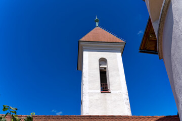 Looking up facade of catholic Church of St. Sebastian, Fabian and Roch at Pungart at the old town of Kranj on a sunny summer day. Photo taken August 10th, 2023, Kranj, Slovenia.