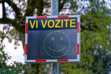 Close-up of speed measuring screen with text you are driving at rural Slovenian village of Zabnica...