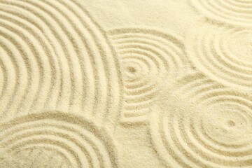 Zen rock garden. Circle patterns on beige sand, closeup