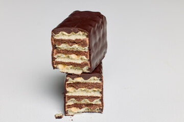 A wafer covered in chocolate on a white background