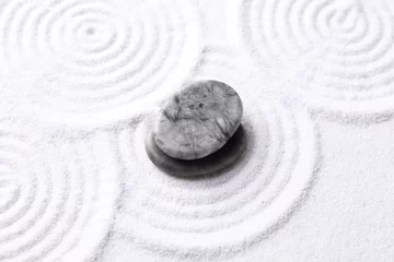 Deurstickers Zen garden stones on white sand with pattern, above view © New Africa
