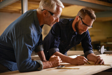 Family, father and son in a workshop, architect and woods with drawing or safety glasses with...