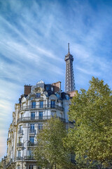 Beautiful Haussmann facades in a luxury area of Paris with the Eiffel Tower in the background