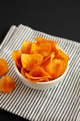 Paprika Potato Chips in a Bowl, side view.