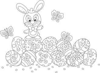 Greeting card with a happy Easter bunny and painted gift eggs with merrily flying butterflies, black and white outline vector cartoon illustration for a coloring book