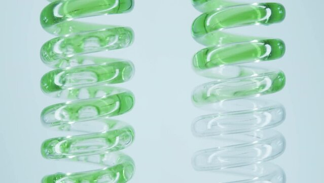 Obtaining an extract from natural herbs and algae. Natural cosmetics production. Obtaining a medicinal extract from herbs. The technician mixes the green reagent with water in a flask.