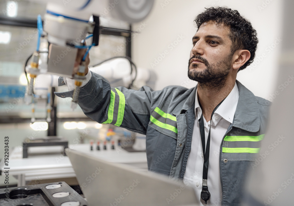 Wall mural latino robotic development engineer working robot arm connection control at electronic futuristic sc