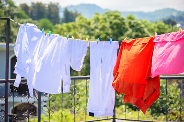 The washed clothes are hung up and drying in the wind.