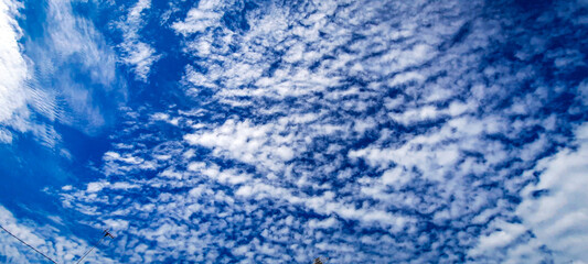 Beautiful clear blue sky with some scattered clouds