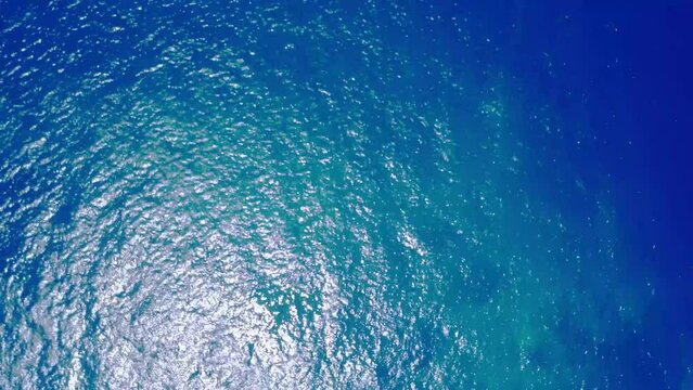 Top view of crystal clear sea water texture. Blue ocean wave. Motion graphic 