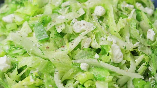Maroulosalata Greek Lettuce Salad with with iceberg lettuce, herbs, feta cheese.
