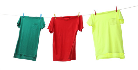 Colorful t-shirts drying on washing line isolated on white