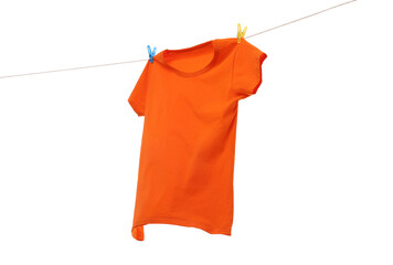 One orange t-shirt drying on washing line isolated on white
