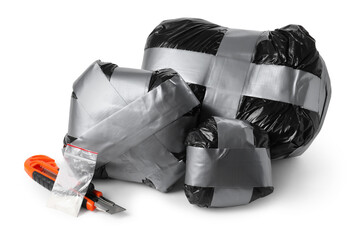 Packages with narcotics and stationery knife isolated on white