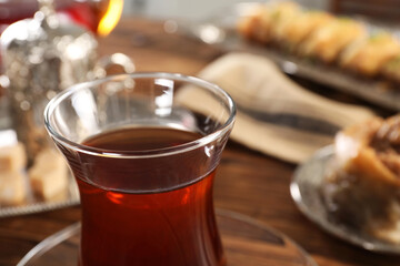 Traditional Turkish tea in glass on table, closeup. Space for text