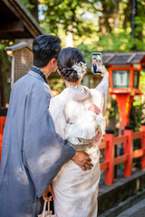 A couple wearing Japanese Kimono, back view. Kyoto, Japan.
