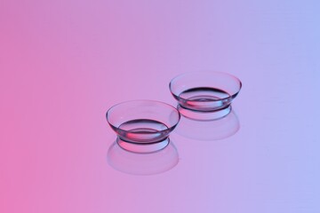 Obraz na płótnie Canvas Pair of contact lenses on mirror surface