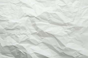 Crumpled notebook sheet as background, top view