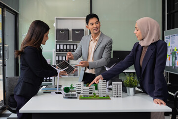 Businessman team brainstorming using tablet, laptop computer for working technology and business, Renewable energy-based green businesses and global warming. Reduce CO2 emission.