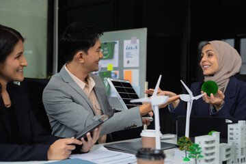 Businessman team brainstorming using tablet, laptop computer for working technology and business, Renewable energy-based green businesses and global warming. Reduce CO2 emission.