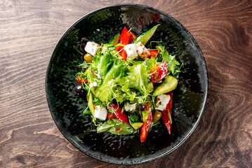 greek salad with cheese, tomato, olive, pepper, onion