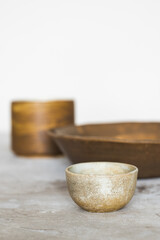 Ceramic tea bowl. Handmade ceramic sauce pan. Minimalism style, hard light. Front view. Japanese ceramics. Tea ceremony.