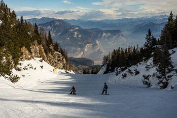 Family ride snowboarding. Ski resort Paganella Andalo, Trentino-Alto Adige, Italy. Ski slopes and...