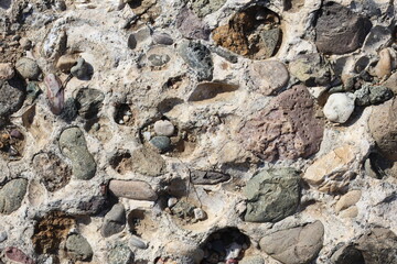 Top view a conglomerate composed of rounded to subangular gravel-size clasts.