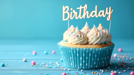 Delicious birthday cupcake on blue wooden table, closeup view