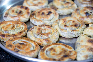 Vintage Oven Delights: Delectable Stuffed Pastries Await Baking in the Old Oven, A Culinary Tradition