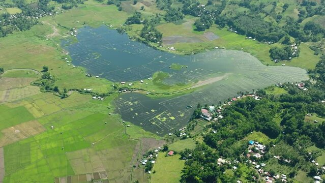 Beautiful landscape with agricultural fields around the Lake Seloton with fish farm. Lake Sebu. Mindanao, Philippines.