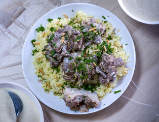 mansaf and jameed served on table, with copy space