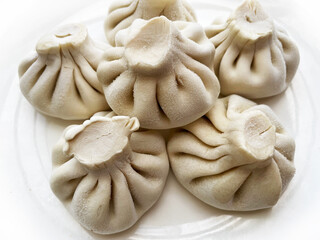  frozen khinkali on a white plate