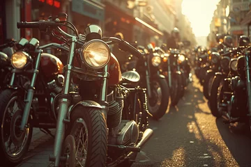 Poster A classic collection of vintage motorcycles parked on an urban street captured in the warm glow of the setting sun © Vladan