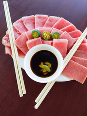 A plate of tuna and soy sauce with wasabi in local restaurant.