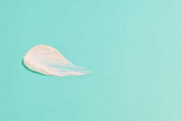 White cosmetic cream smash, texture sample