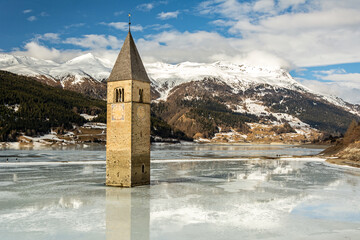 Flooded church tower in Lake Reschen (Reschensee) in South Tyrol, Italy