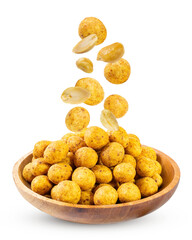 Falling peanuts into a wooden bowl isolated on white background