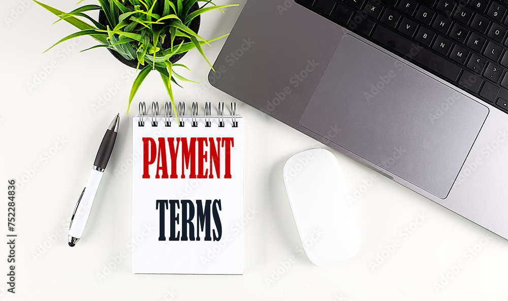 Poster payment terms text written on notebook with laptop and mouse , white background