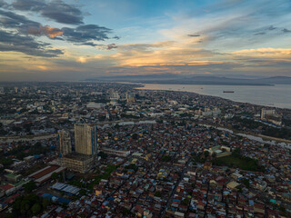 Coastal city with modern buildings and river. Davao City. Mindanao, Philippines.