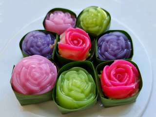 Fototapeta premium Close-up traditional colorful sweet Thai desserts, Khanom Alua Kularb or Rose shaped sweetmeats