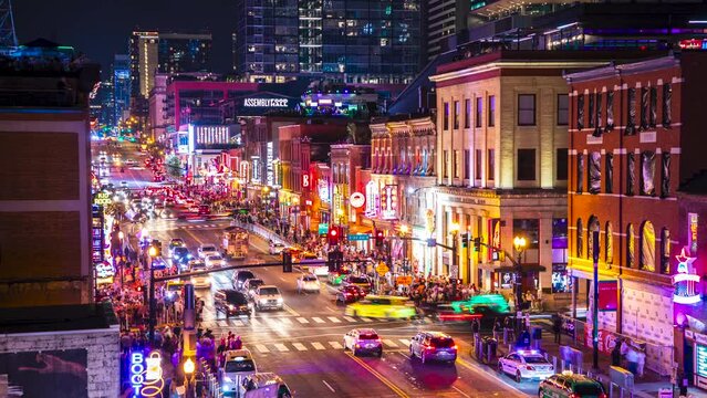 A vibrant 4K aerial timelapse capturing the energy of Broadway in Nashville, Tennessee bustling with traffic and lively crowds visiting the bars and honky-tonks.