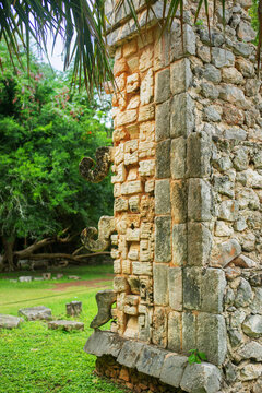 hooks on the corner of the colomn covered with carved in stone hieroglyphic inscriptions in Chichen-Itza