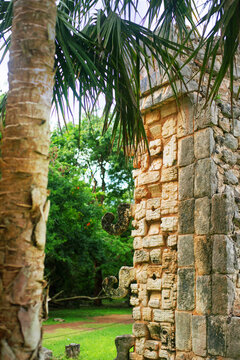 hooks on the corner of the colomn covered with carved in stone hieroglyphic inscriptions in Chichen-Itza