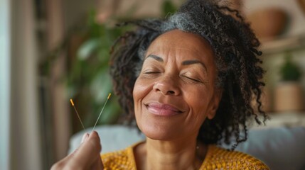 Middle-aged woman trying out acupuncture therapy to alleviate menopause symptoms, showing openness to alternative treatments - obrazy, fototapety, plakaty