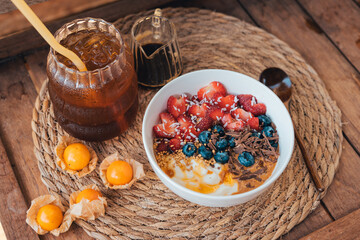 Oatmeal topped with fruit yogurt Chocolate and bee pollen