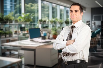 Smiling business man at work in office