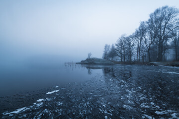 Frozen Lake Next to Forest in Sweden