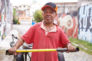 Man, portrait and cart for garbage in street for smile, walk and collect trash for recycling for...